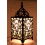 Original lamp in wrought iron craft. Baroque decoration on the cheap.
