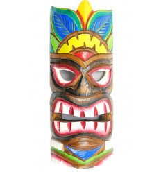 Multicolored wooden tiki mask. Decoration Atmosphere Hawaii Maori.