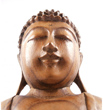Statua di Buddha seduto in meditazione in legno artigianale.