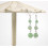 Parasol-shaped earring display in ceruse white solid wood with jewelry